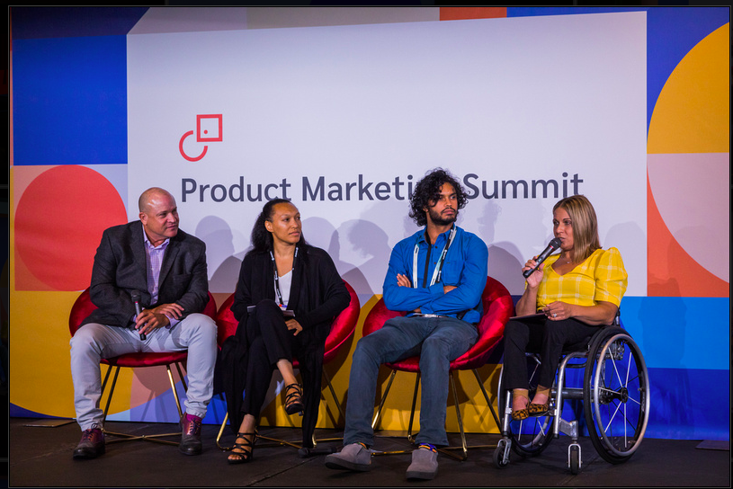 alycia on stage with other panelists at the product marketing summit