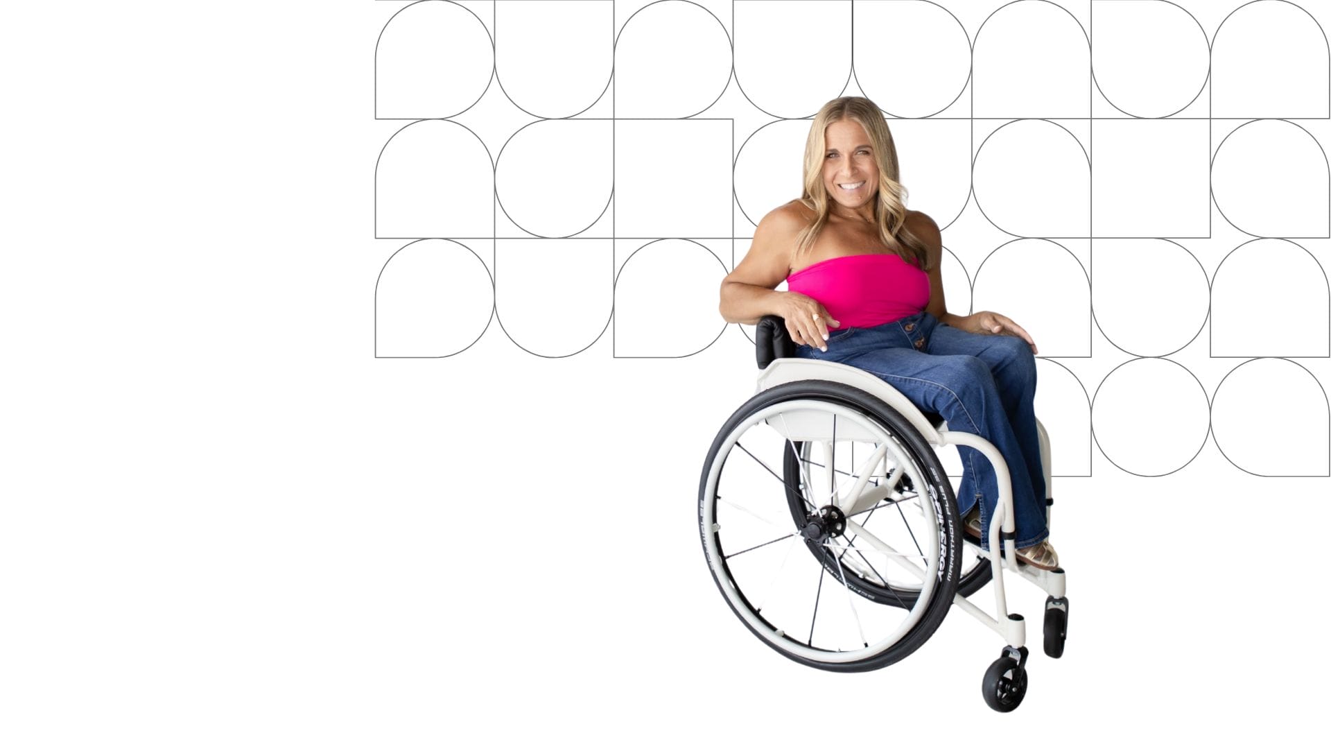 background image with geometrical shapes behind alycia sitting in her wheelchair